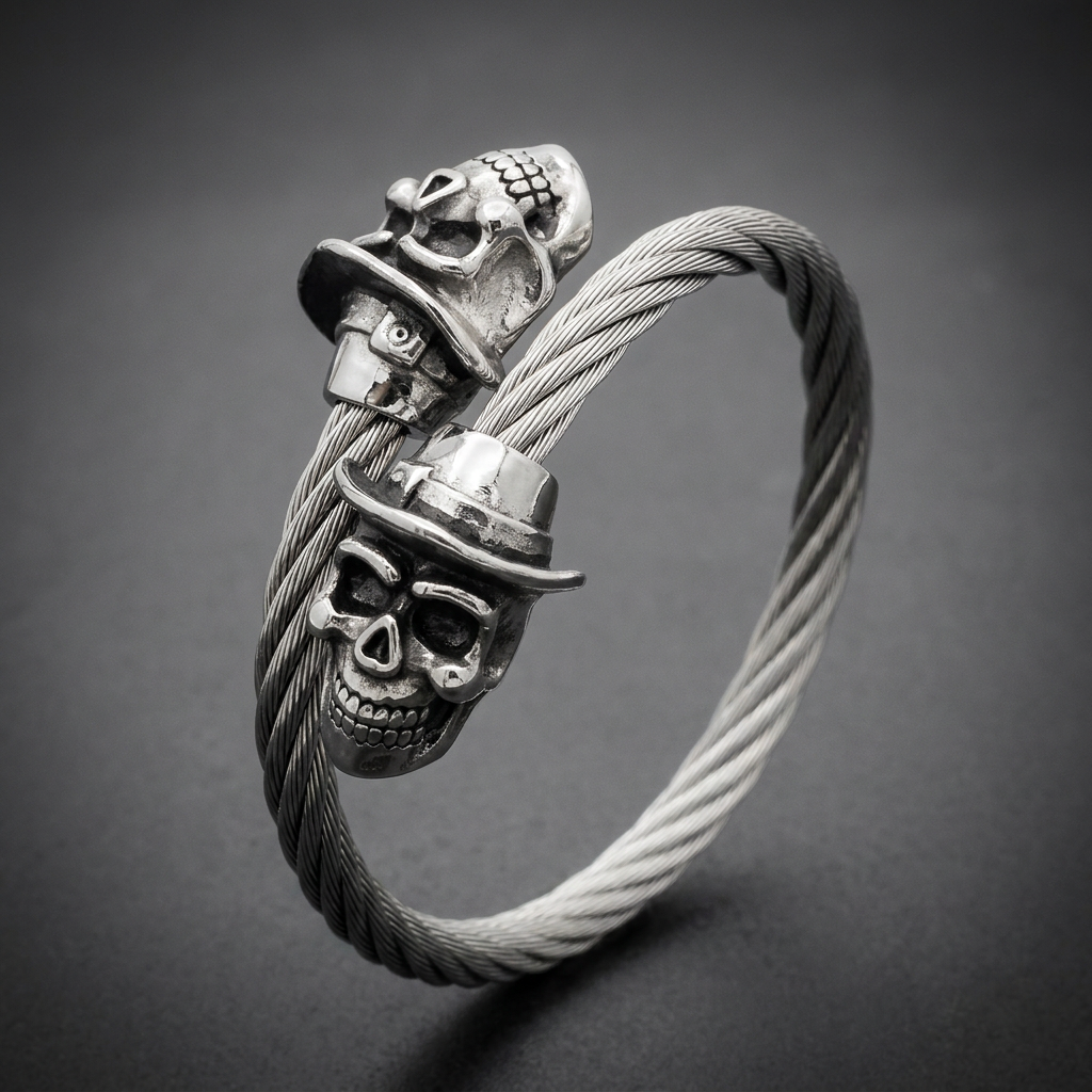 A 316L stainless steel cable bracelet featuring two detailed skulls wearing fedora hats, high polished finish.