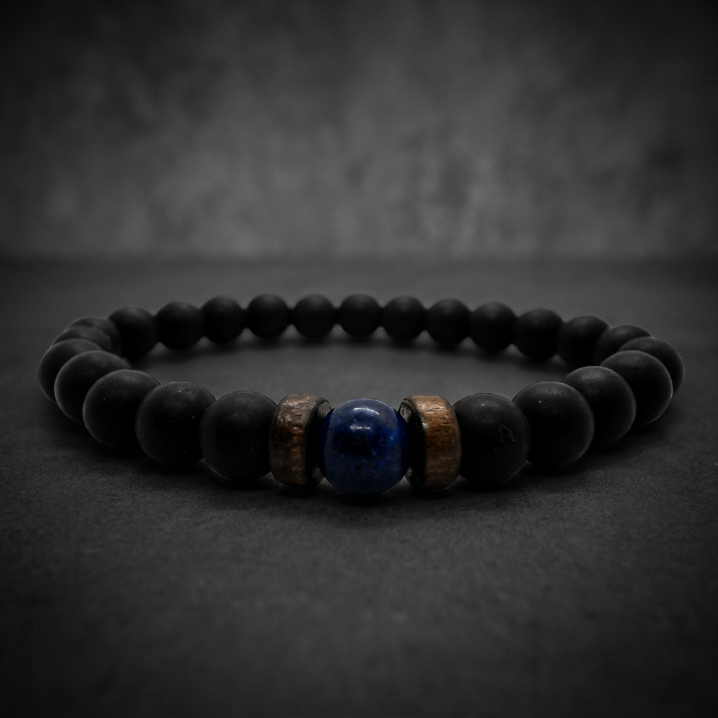 A close-up of the Handmade Black Onyx and Lapis Lazuli Bracelet from SkullJewelry.com, showcasing the matte black onyx beads and polished deep blue lapis lazuli gems, intertwined with 316L stainless steel accents.
