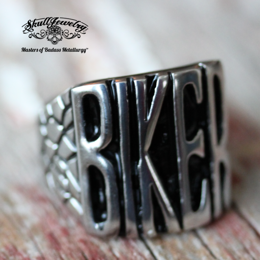 badass biker stainless steel ring on vintage painted wood