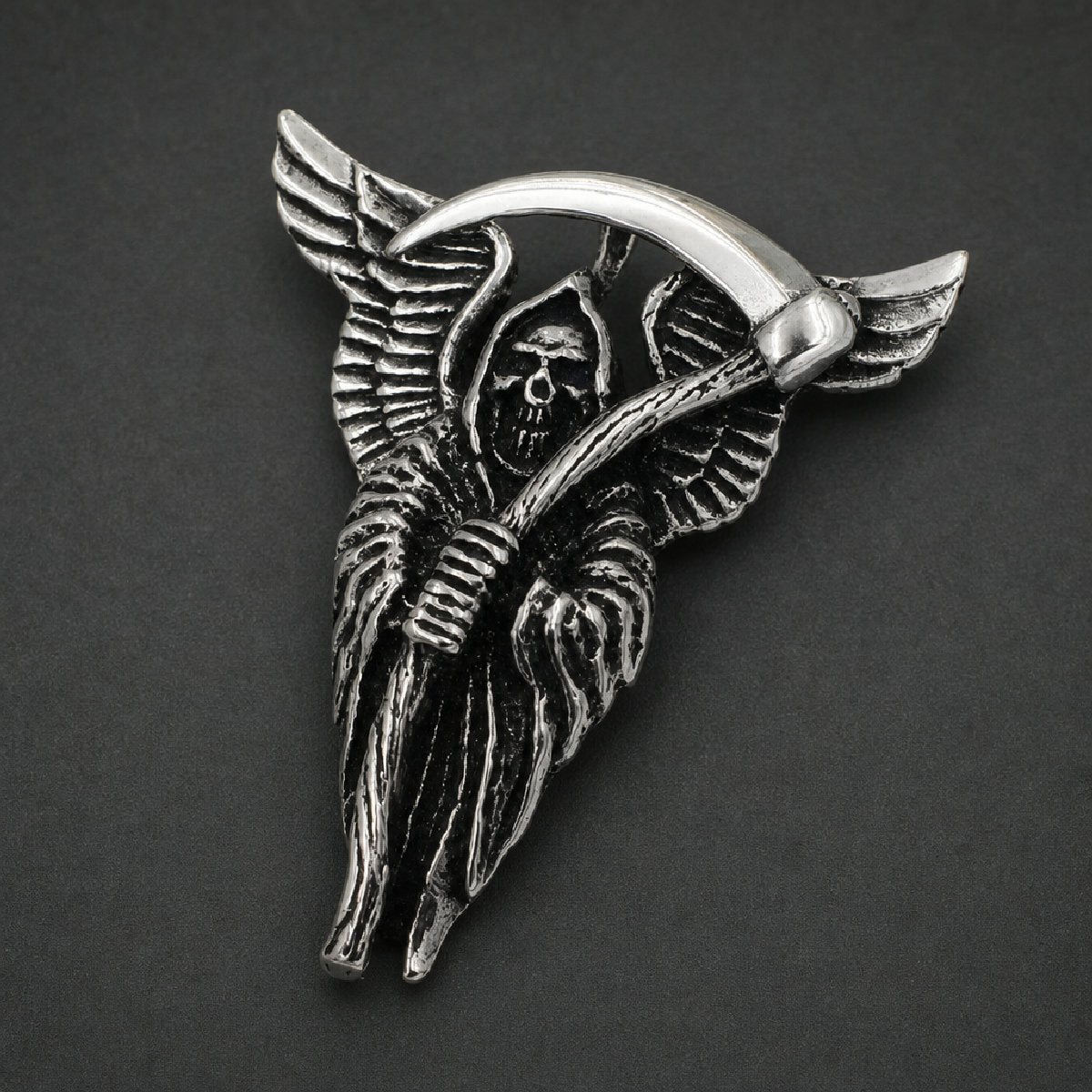316L stainless steel winged grim reaper pendant holding an arched scythe with feathered wings and antiqued black detailing