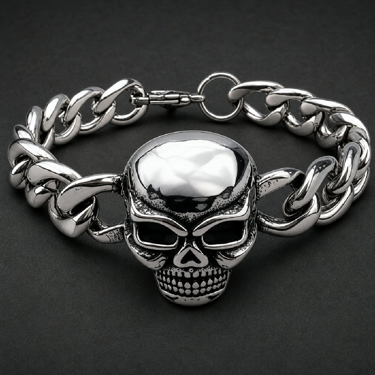 Heavy 316L stainless steel skull bracelet with polished curb links and black oxidized hollow eye sockets