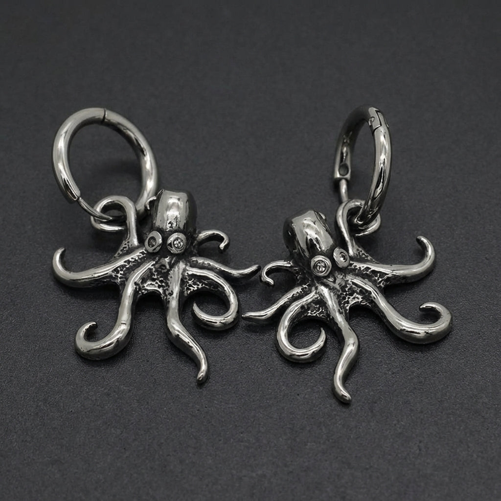 A pair of silver-toned Oceanic Tentacle Hoops earrings, featuring detailed octopus tentacle designs curling around a hinged hoop.