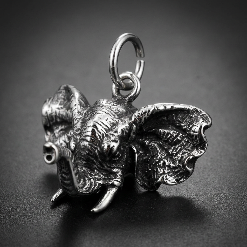 Heavy 316L stainless steel elephant head pendant with detailed wrinkled skin texture, large flared ears, and prominent tusks, in a polished silver-tone finish.