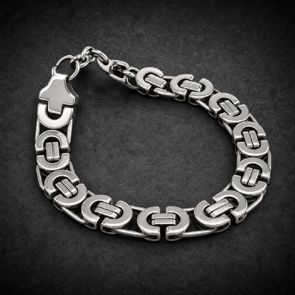 Close-up of a heavy Iron Claw C-Link biker bracelet made of 316L stainless steel, showing detailed robust links.