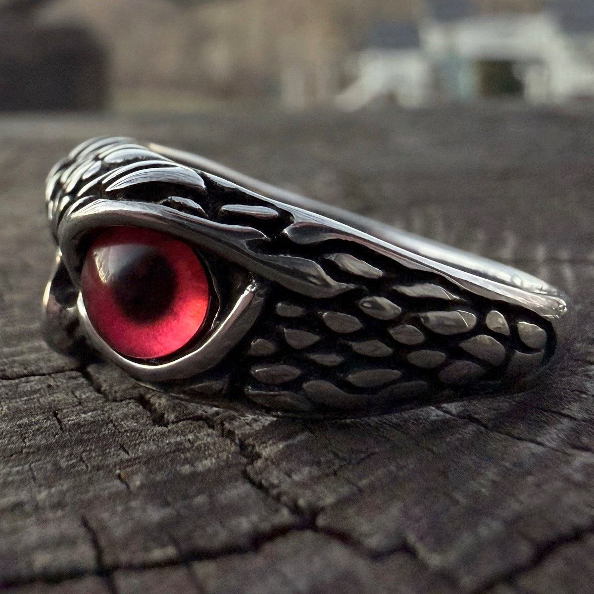 Stainless steel owl ring featuring a low profile and red eye detail