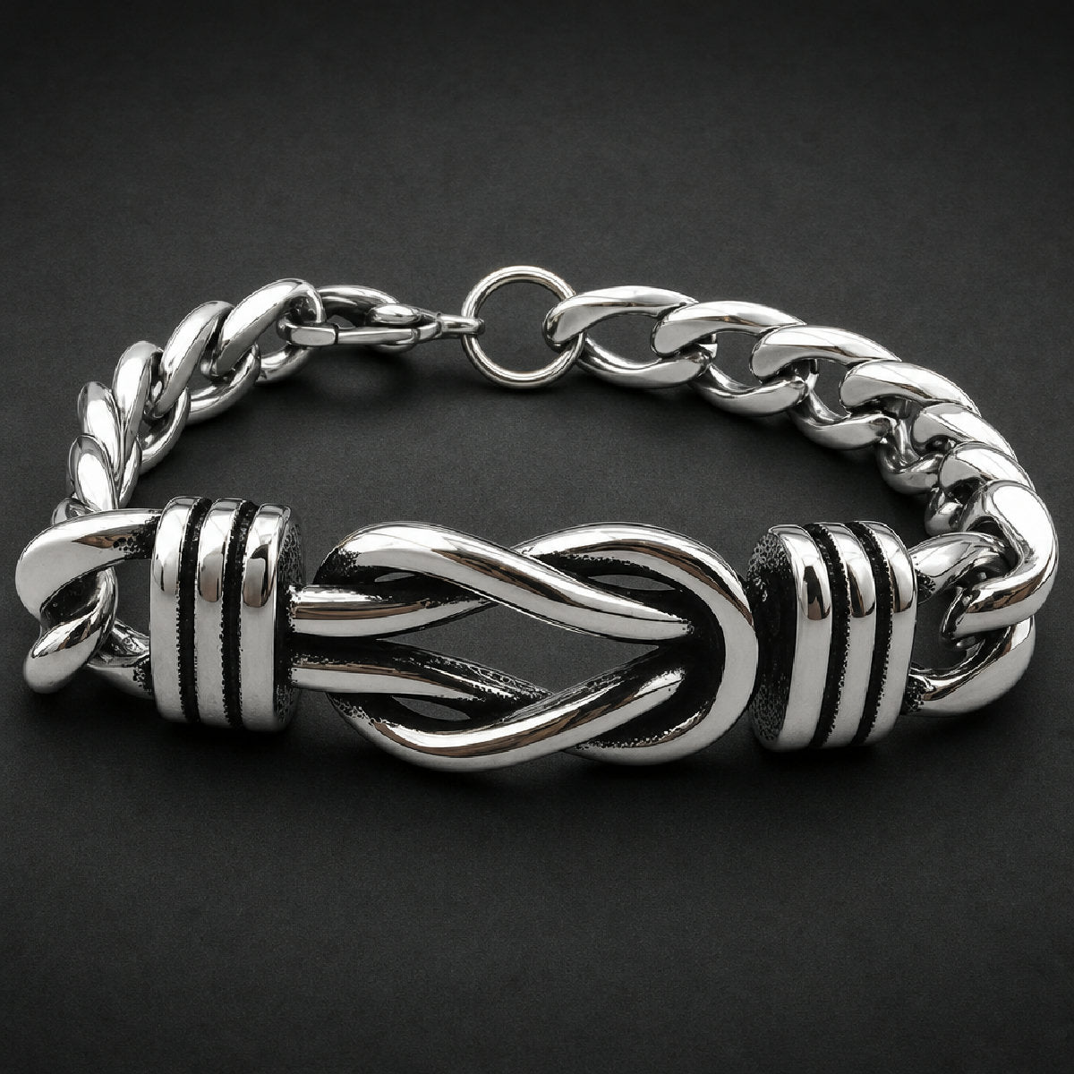 Unisex 316L stainless steel bracelet featuring an entwined cinch centerpiece with grooved end caps and heavy curb links