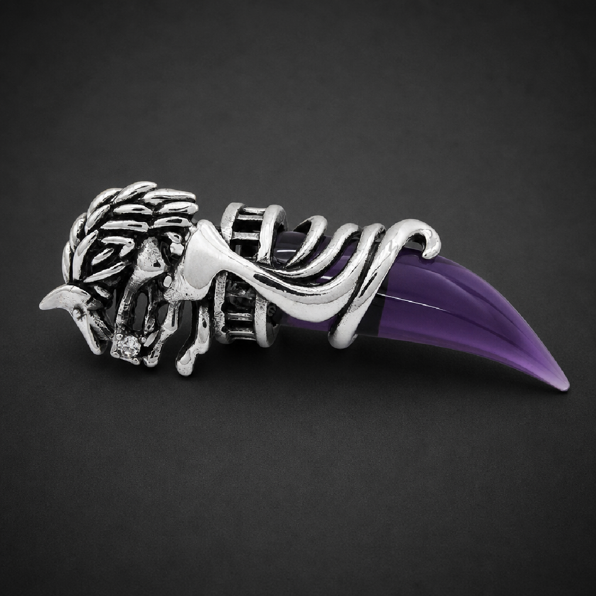 Fenrir's Fang purple wolf's tooth pendant in 316L surgical stainless steel with an intricate silver wolf's head holding a polished purple claw.