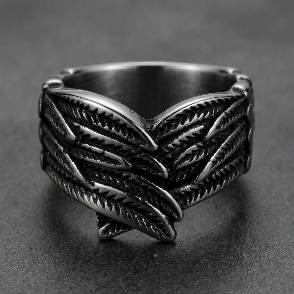 Heavy 316L stainless steel ring with a detailed feathered wing motif, dark silver finish.