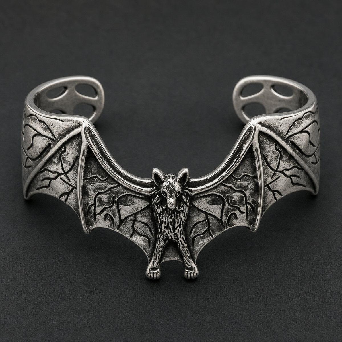 Front view of 316L stainless steel bat cuff bracelet featuring spread wings with oxidized webbing and textured body