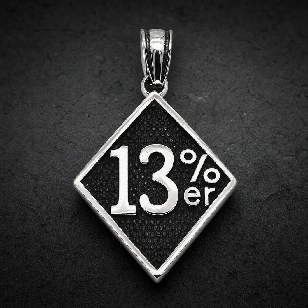 Silver polished 316L stainless steel 13%er diamond pendant with black textured background