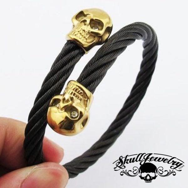 9" Black Steel Cable Bracelet with Double GOLD Overlay Skulls and White Gem Stone Eyes