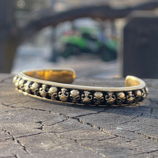 Gold-Tone '28 Skulls' Skull Bangle Bracelet