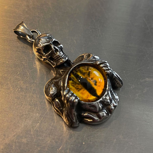 Skeleton Holding Yellow Dragon Eye Pendant