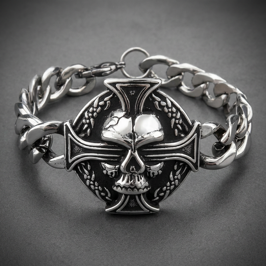 Heavy 316L stainless steel bracelet featuring an etched central skull on a cross emblem, connected to thick cuban link chain with secure clasp, in a bright silver and dark oxidized finish.
