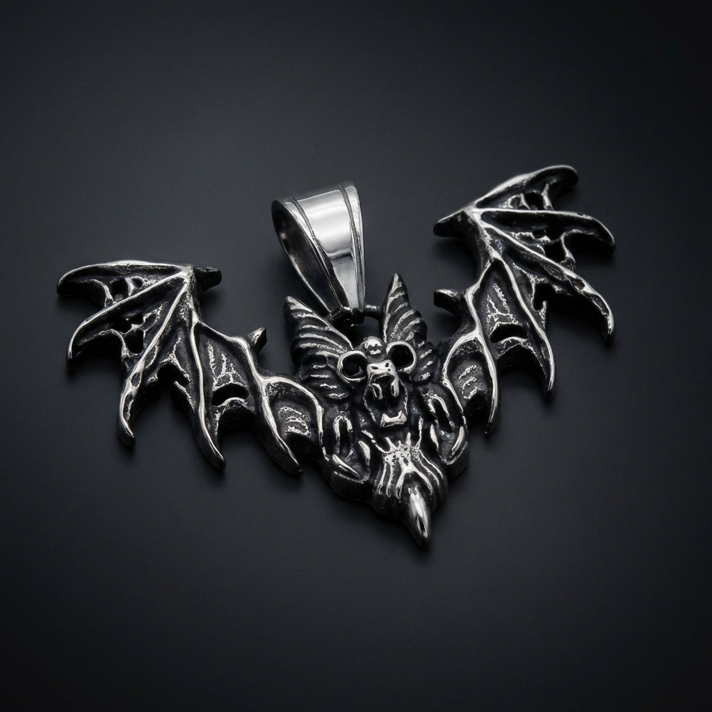 Nocturne Bat Stainless Steel Pendant with detailed wings spread wide on a black background
