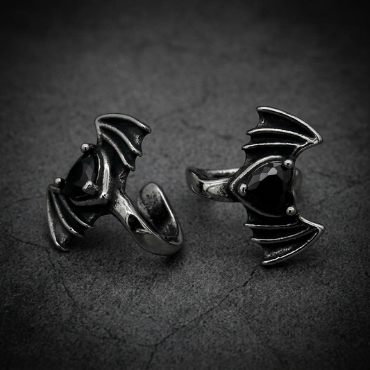 A sharp, aggressive Viper Bat Wing Lip pendant in 316L stainless steel with a dark, commanding gemstone