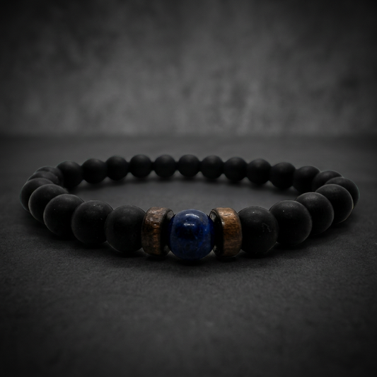A close-up of the Handmade Black Onyx and Lapis Lazuli Bracelet from SkullJewelry.com, showcasing the matte black onyx beads and polished deep blue lapis lazuli gems, intertwined with 316L stainless steel accents.