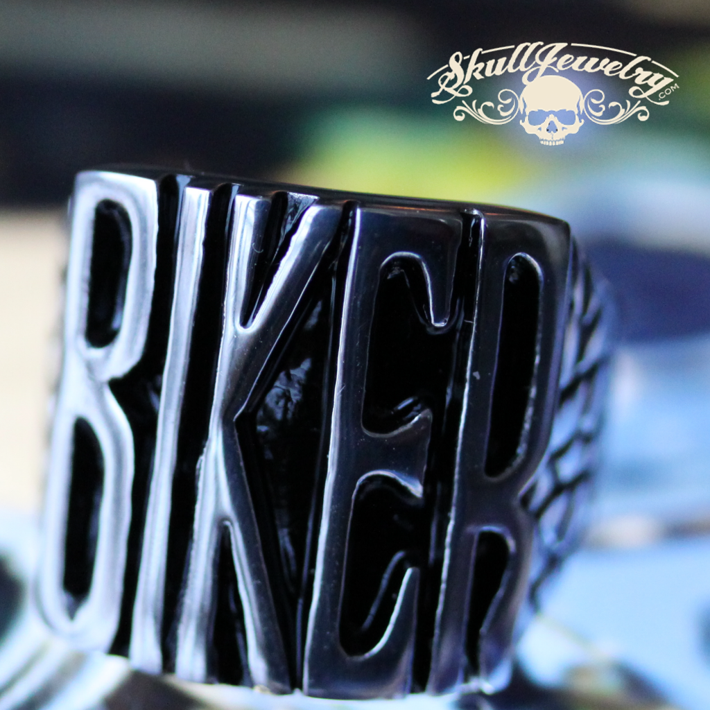 badass biker stainless steel ring sitting on a sturgis vintage harley davidson