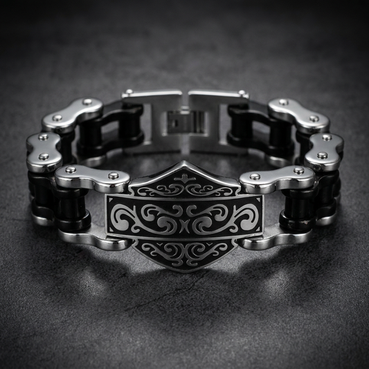 Iron Shield Bracelet made of polished 316L surgical-grade stainless steel with intricate black enamel details, shown on a wrist.