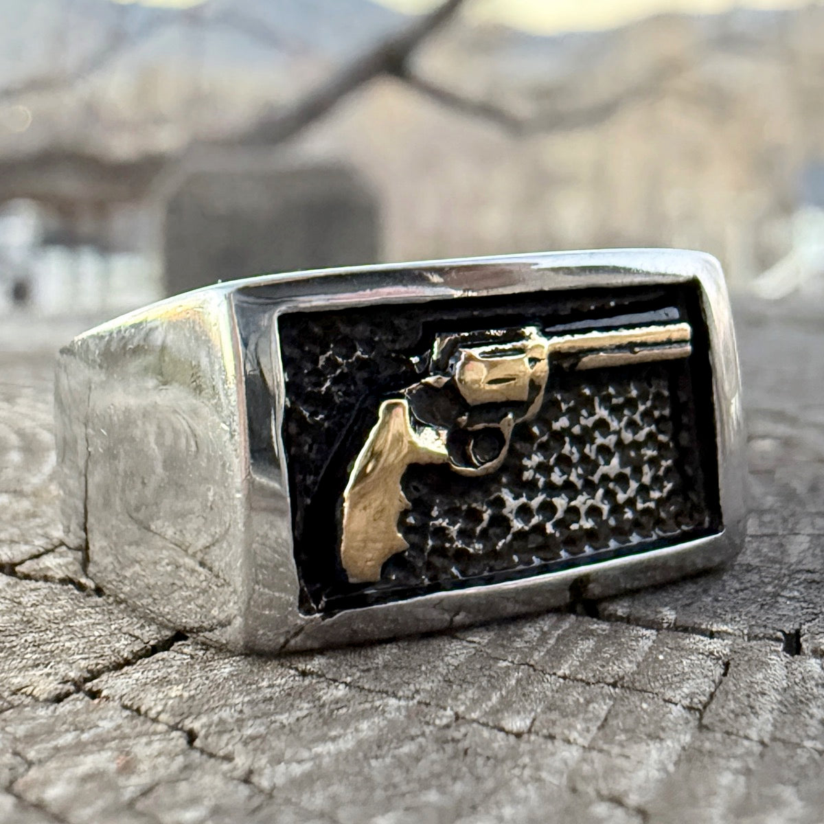 Stainless steel gun signet ring with black recessed background