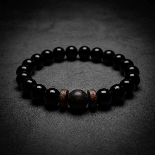 Polished Onyx Bracelet with smooth, reflective black beads on a model's wrist, showcasing its elegant and modern design.