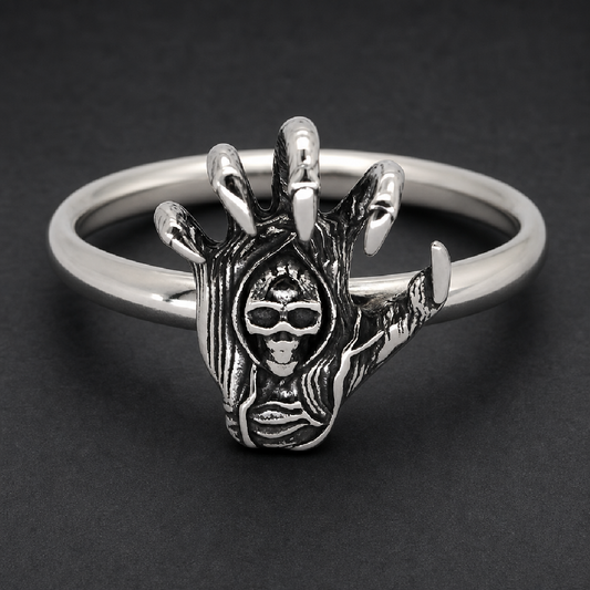 Skeletal hand with claws gripping a skull 316L stainless steel ring