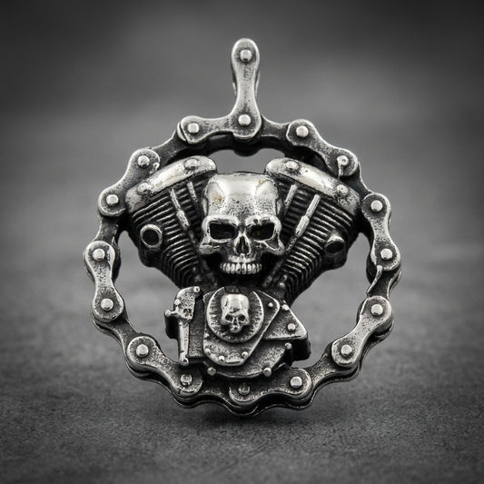 Crested Engine pendant 316L stainless steel, biker skull theme, V-twin engine design encircled by a motorcycle chain, dark oxidized finish, unisex.