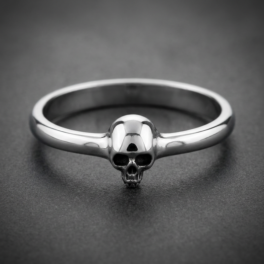 Minimalist Skull Ring in 316L stainless steel with a polished finish and HardKnocker construction, featuring a small, detailed skull centered on a smooth band.