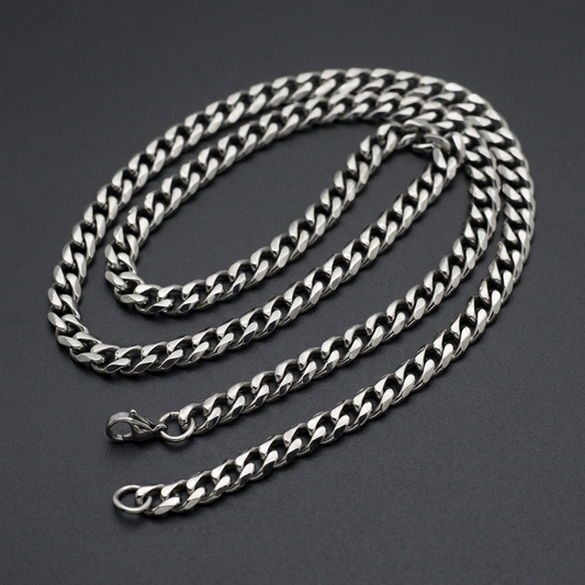 Bold Curb Chain Necklace for men, made of polished 316L stainless steel, showcasing thick, interlocked curb links against a dark background.