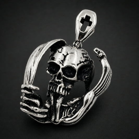 316L stainless steel cranium pendant enclosed in curved skeletal hands with cross cutout bail