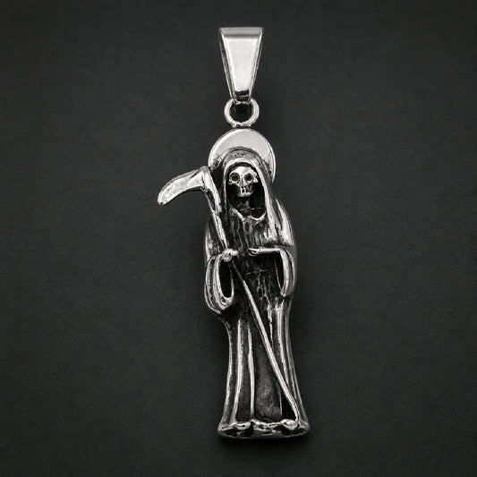 Silver and black 316L stainless steel unisex pendant depicting a cloaked harvester figure holding a scythe with an arched halo