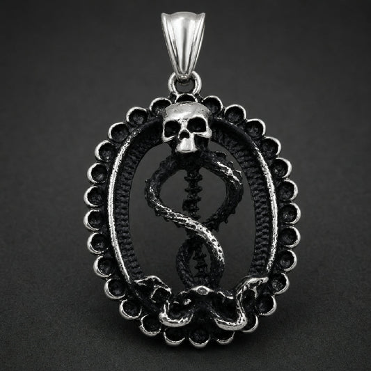 Antiqued 316L stainless steel skull and serpent pendant featuring a skull atop an entwined spinal column inside a beaded oval medallion