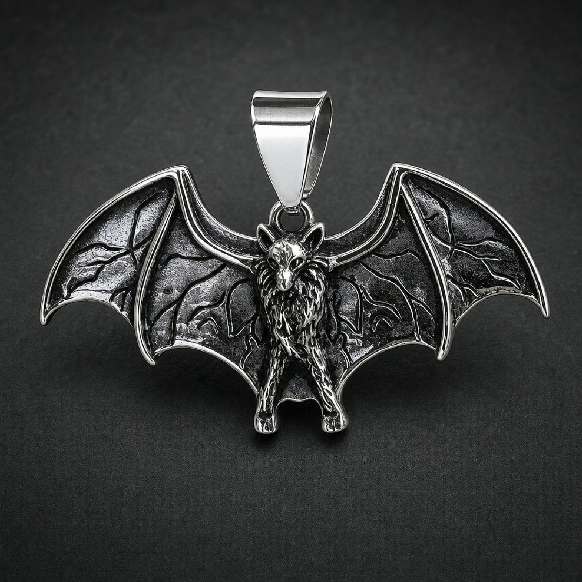 Unisex bat pendant in 316L surgical stainless steel with spread wings and dark antiqued oxidation