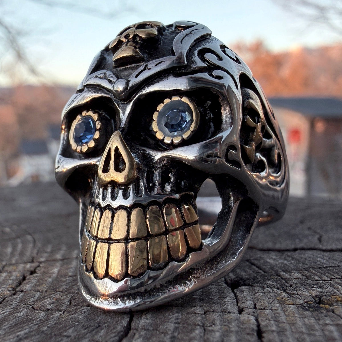 Stainless steel calavera skull ring with blue eyes and gold details