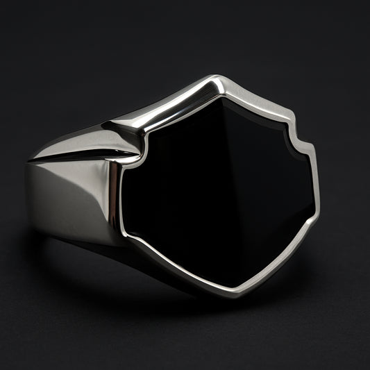 Onyx Shield Biker Ring in 316L stainless steel featuring a bold shield design with a black onyx inlay.