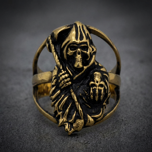 Unisex HardKnocker Grim Reaper ring in brass-toned 316L surgical-grade stainless steel with dark sculpted details.