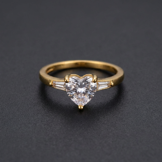 Golden Promise Band, a gold-finished 316L stainless steel ring with a central heart-shaped stone and subtle side sliver stones.