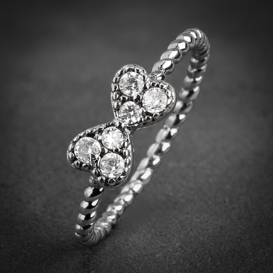 Sparkling Ribbon Toe or Mid-Ring with dual heart motif and shiny gems on a twisted band made of polished 316L stainless steel.