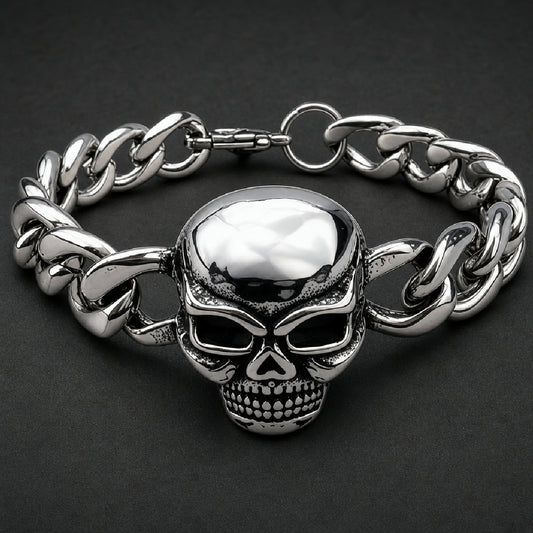 Heavy 316L stainless steel skull bracelet with polished curb links and black oxidized hollow eye sockets