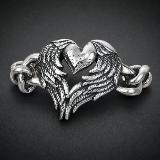 Unisex 316L stainless steel bracelet featuring a textured heart framed by detailed feathered wings and heavy curb links