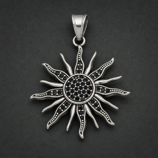 Silver 316L stainless steel sunburst pendant featuring radiating flame rays and micro-pave black stones in the center.