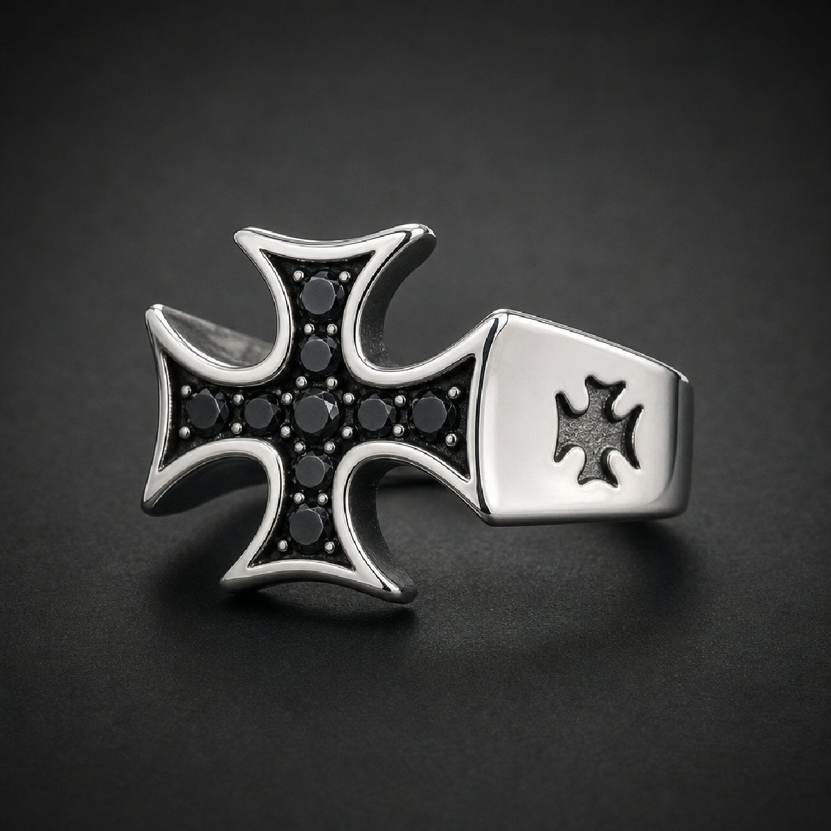 Bold Iron Cross Ring with black crystals, 316L stainless steel. Polished silver and dark crystal details.