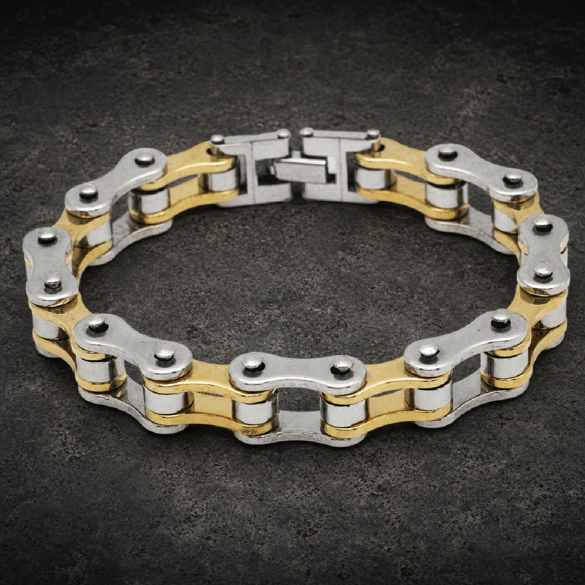 Heavy 316L stainless steel motorcycle chain link bracelets shown in silver, gold, two-tone, and black finishes with fold-over clasps