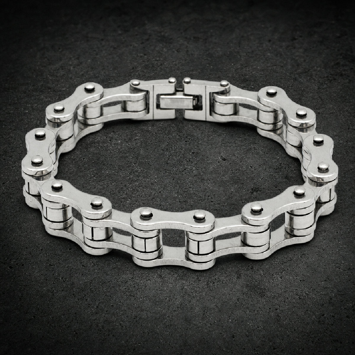Heavy 316L stainless steel motorcycle chain bracelet shown in multiple metallic finishes with fold-over clasp.