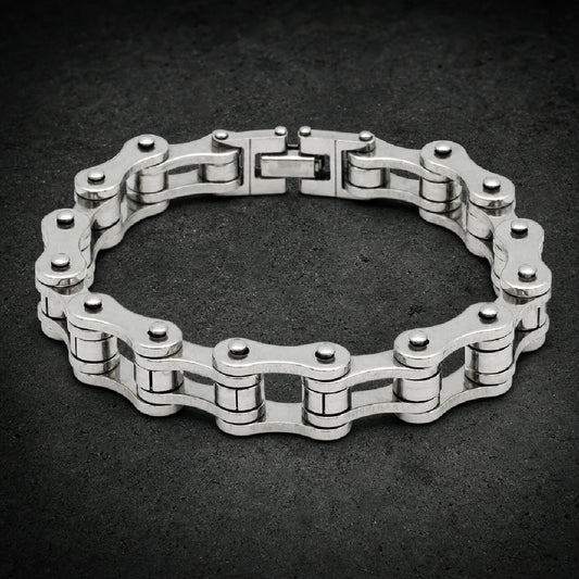 Heavy 316L stainless steel motorcycle chain bracelet shown in multiple metallic finishes with fold-over clasp.