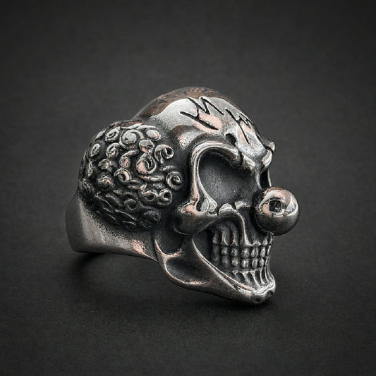Heavy 316L surgical stainless steel jester clown skull ring with polished nose and textured details.