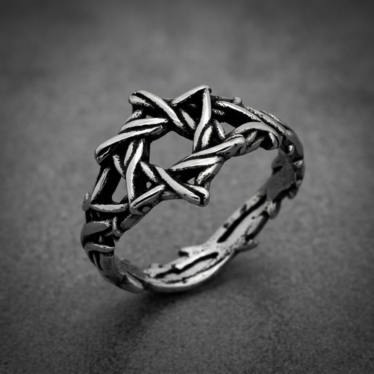Heavy 316L stainless steel Knotwork Star Ring with interwoven, branch-like design and dark oxidized finish on a white background.