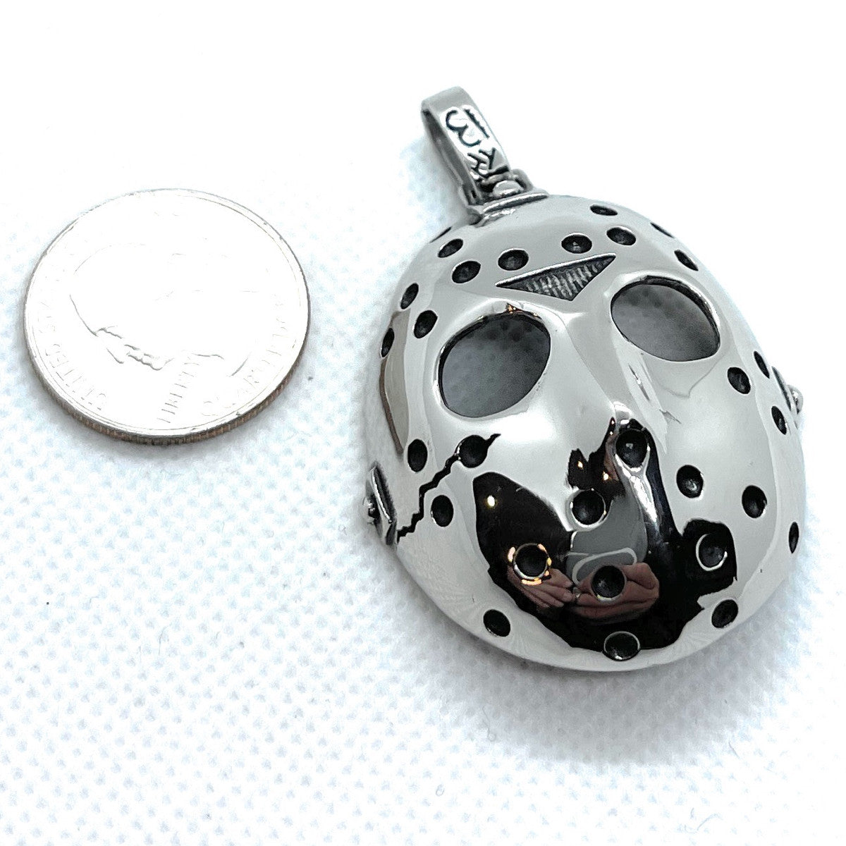 large 'Jason' Mask Pendant size comparison with a us quarter friday the 13th pendant