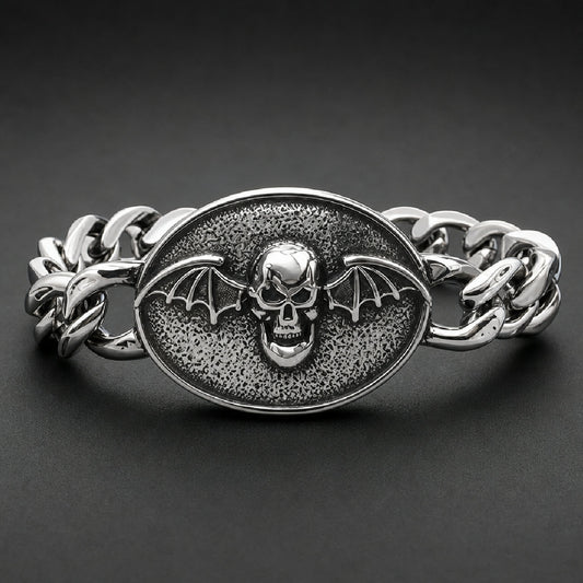 Heavy 316L stainless steel curb chain bracelet with an oval winged skull medallion and dark antiqued background