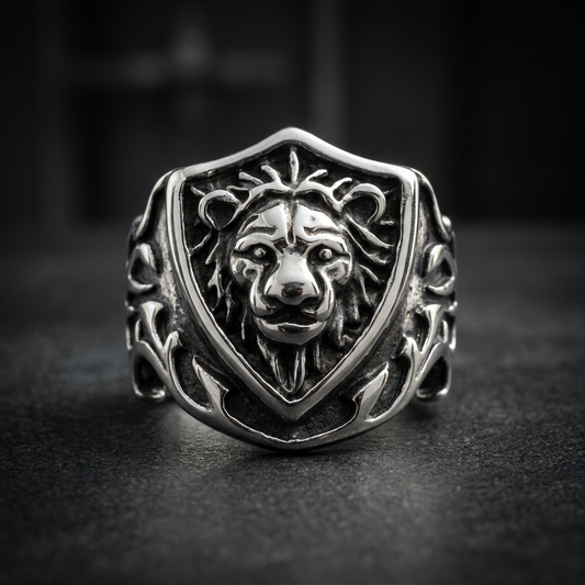 Polished silver 316L surgical stainless steel ring with a detailed lion motif on a shield design, featuring a Gothic vibe.